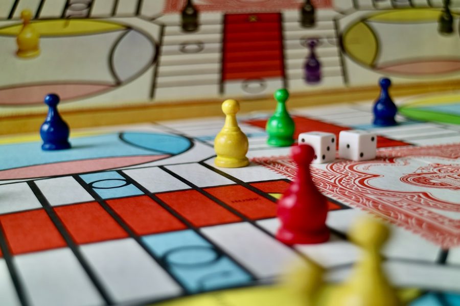 Colourful board game pieces on a table during a team session