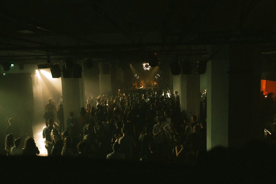 Crowd filling a dark venue at Neon Nights Expo