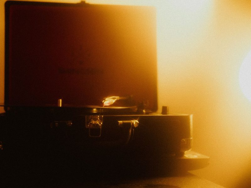 Portable turntable glowing in warm light